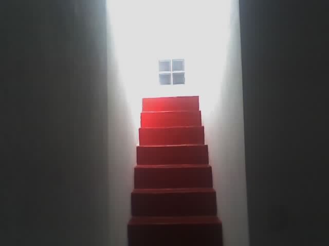 Escalera con microcemento rojo e hidrolaqueado.